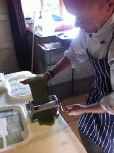 Chef preparing spinach & oregano pasta at our holiday cottages in Suffolk