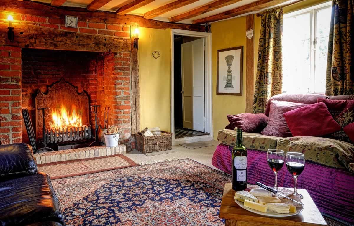 osy log fire at Woodfarm House - Celebrations in your self-catering Suffolk holiday cottage