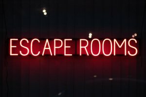 A neon sign spelling out "Escape Rooms"