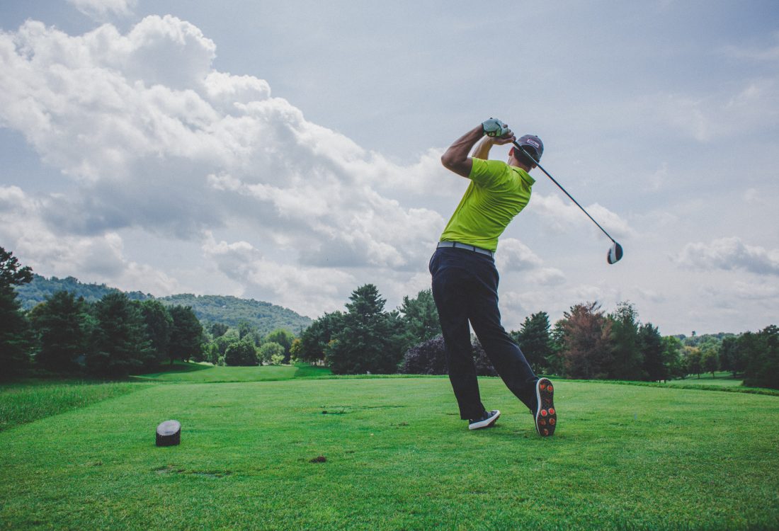 A golfer taking a swing