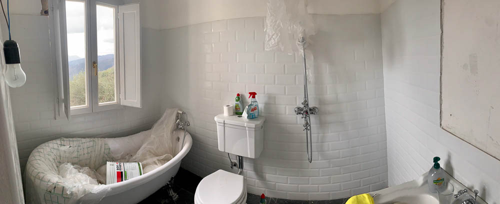 panorama of trebbio bathroom with roll top bath